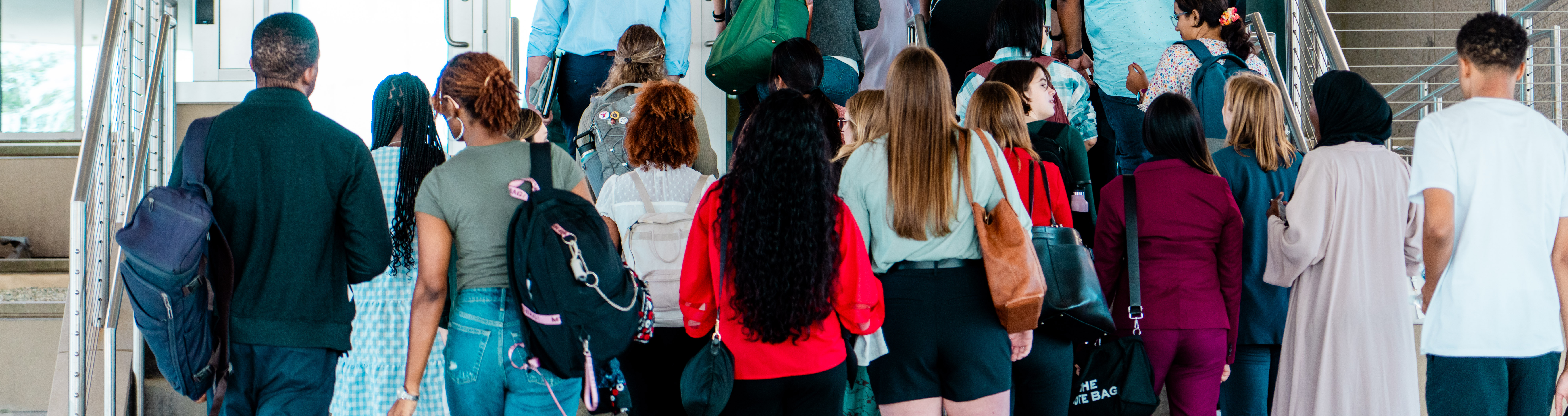 Students walking in the academic entrance