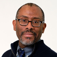 Anton Alerte smiling in headshot photo