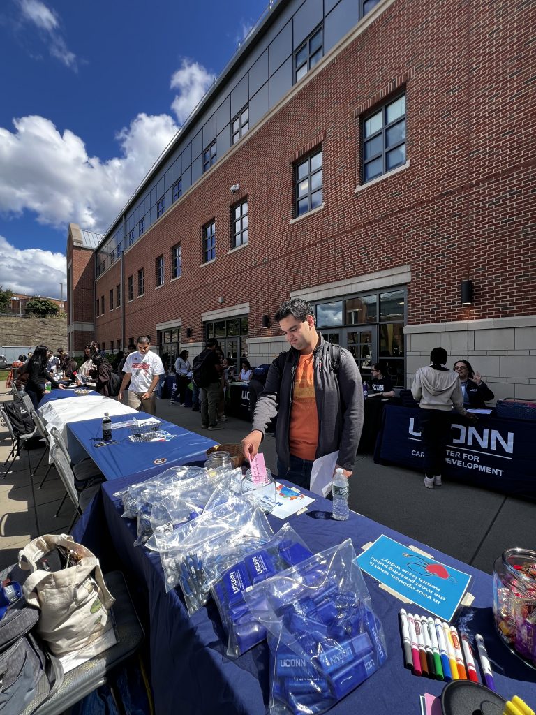 Student picking up UConn Health swag