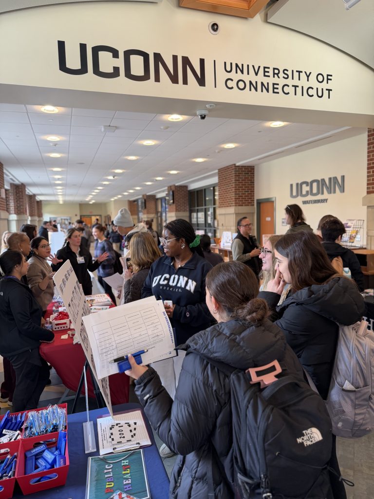 chelsea standing in the midst of students