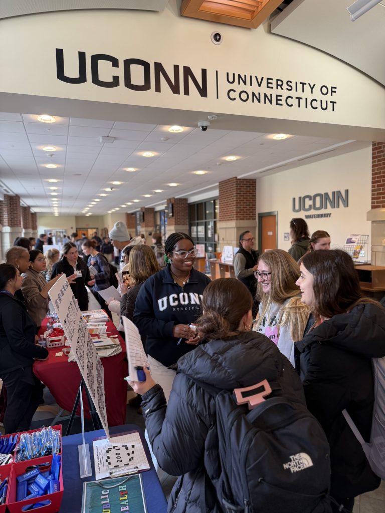 chelsea standing in the midst of students